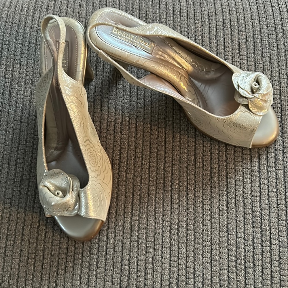 Gold flower pattern sling back. Heavily cushioned. New with box and dust bag.